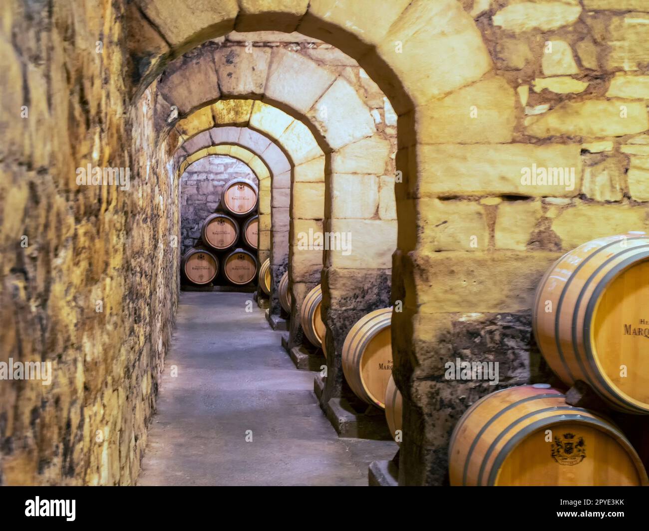 Old wooden barrels for preserving wine, inside the Marques de Riscal winery in the Rioja Alavesa. Stock Photo