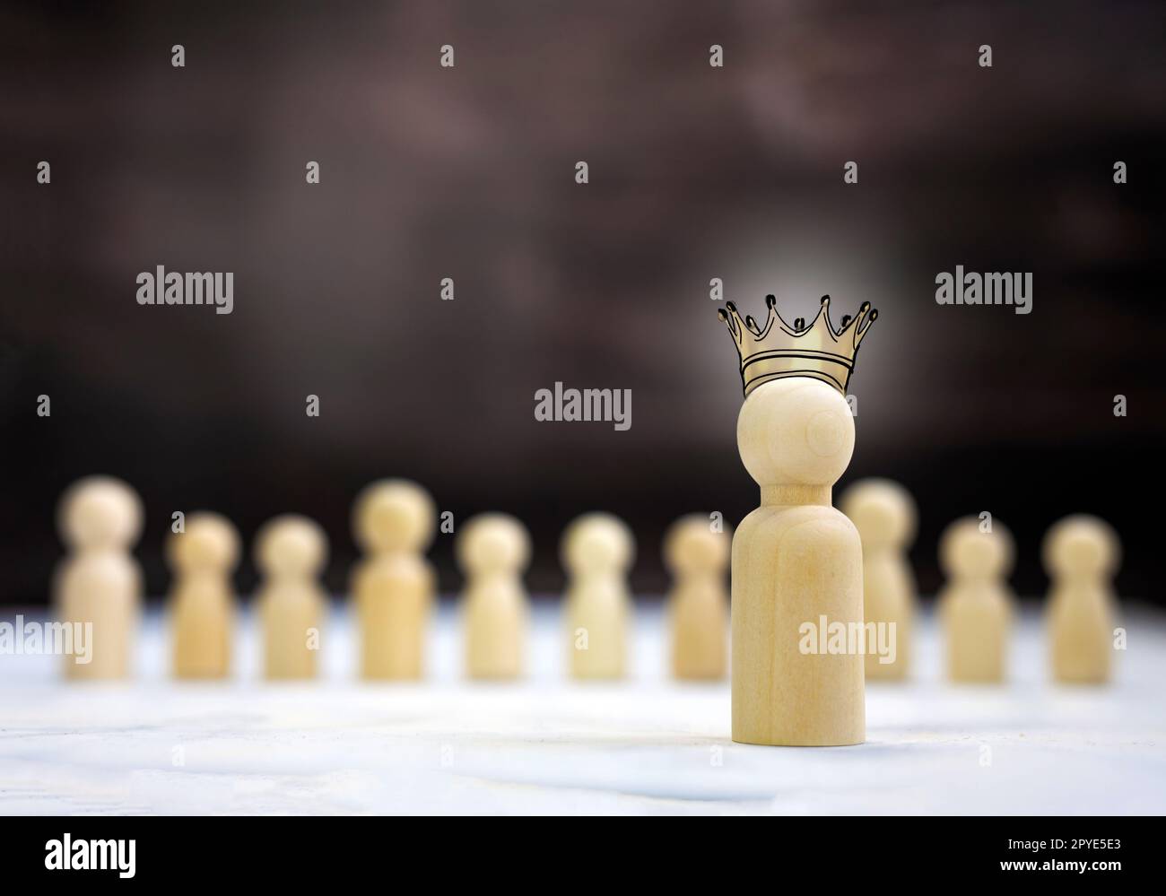 Team leader mockup kings crown, copy space. Leadership, winning, boss. Winner and defeated. Wooden figure on cube,leading a business team group of people concept Stock Photo