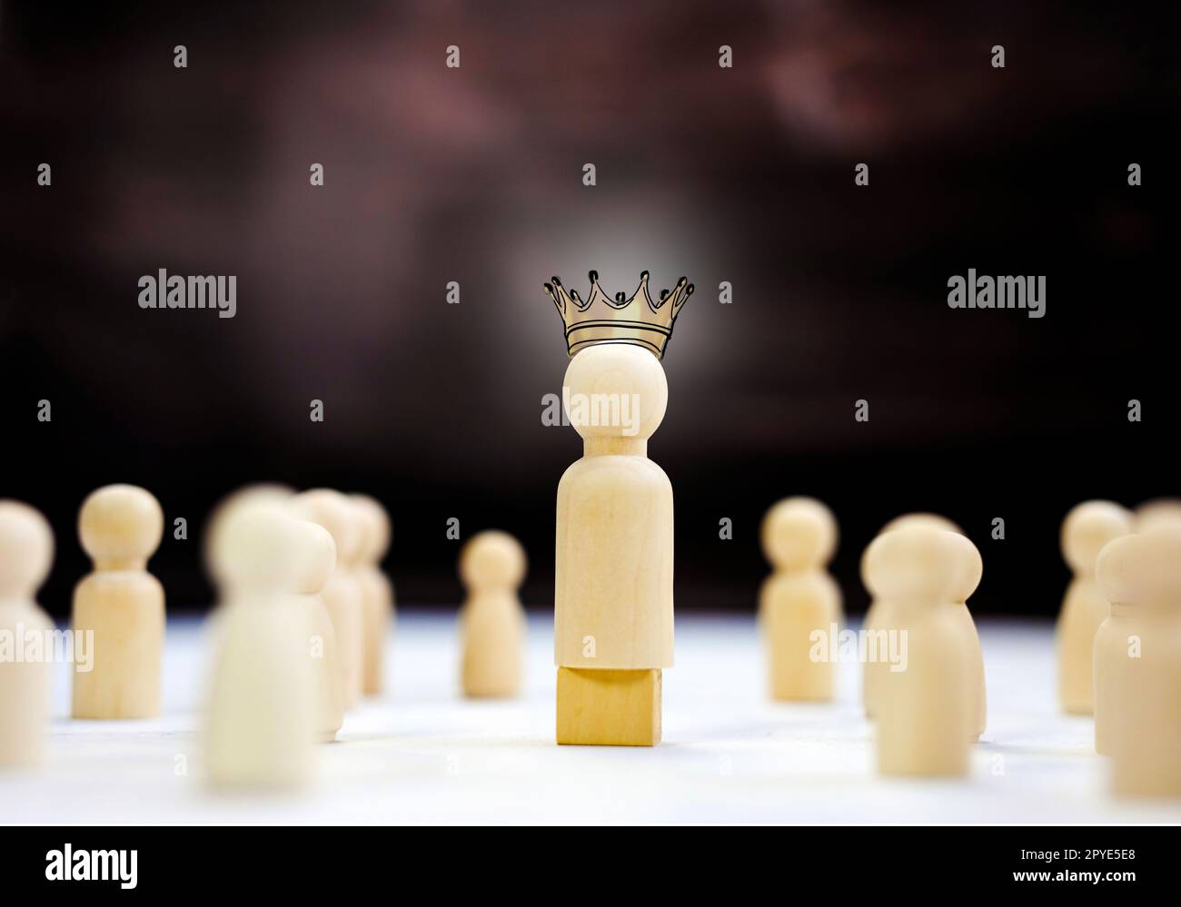 Team leader mockup kings crown, copy space. Leadership, winning, boss. Winner and defeated. Wooden figure on cube,leading a business team group of people concept Stock Photo