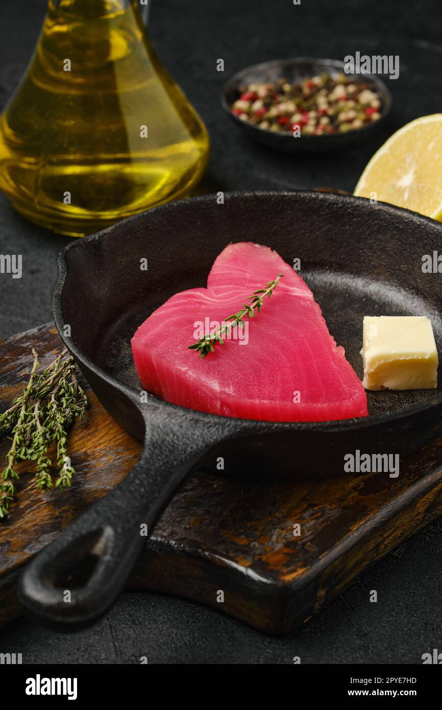 Closeup view of raw fresh tuna steak in cast iron skillet Stock Photo