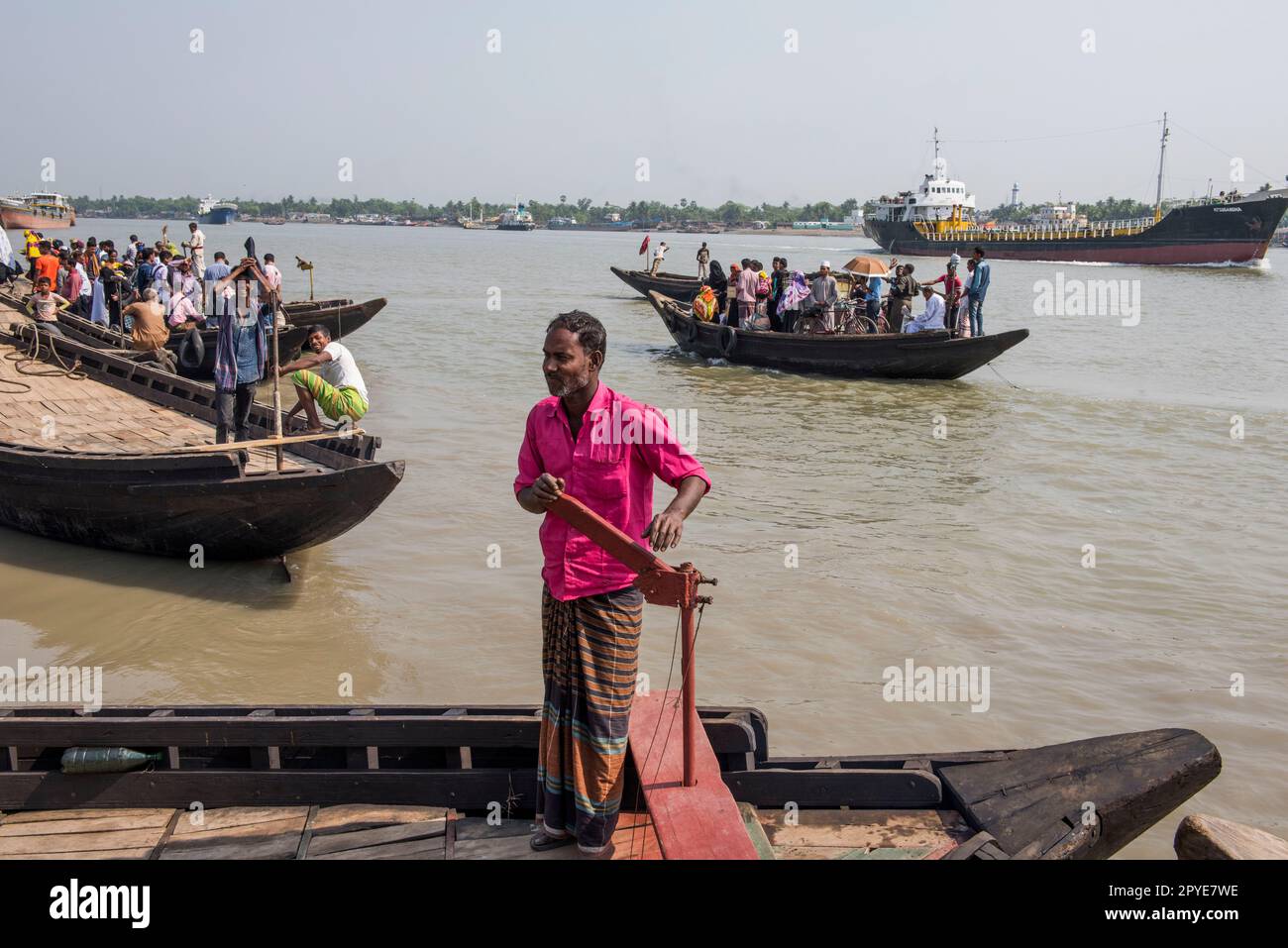 Bangladesh, Khulna. Boats transport locals on the busy waterway of the Rupsha River. March 20, 2017. Editorial use only. Stock Photo