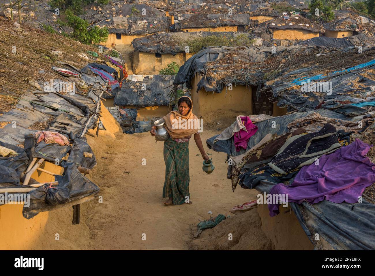 Bangladesh, Cox's Bazar.  A woman collects water at the Kutupalong Rohingya Refugee Camp. March 23, 2017 Editorial use only. Stock Photo