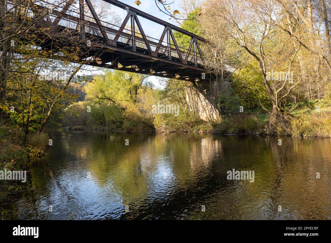 Iron bridge over a river in nature Stock Photo - Alamy