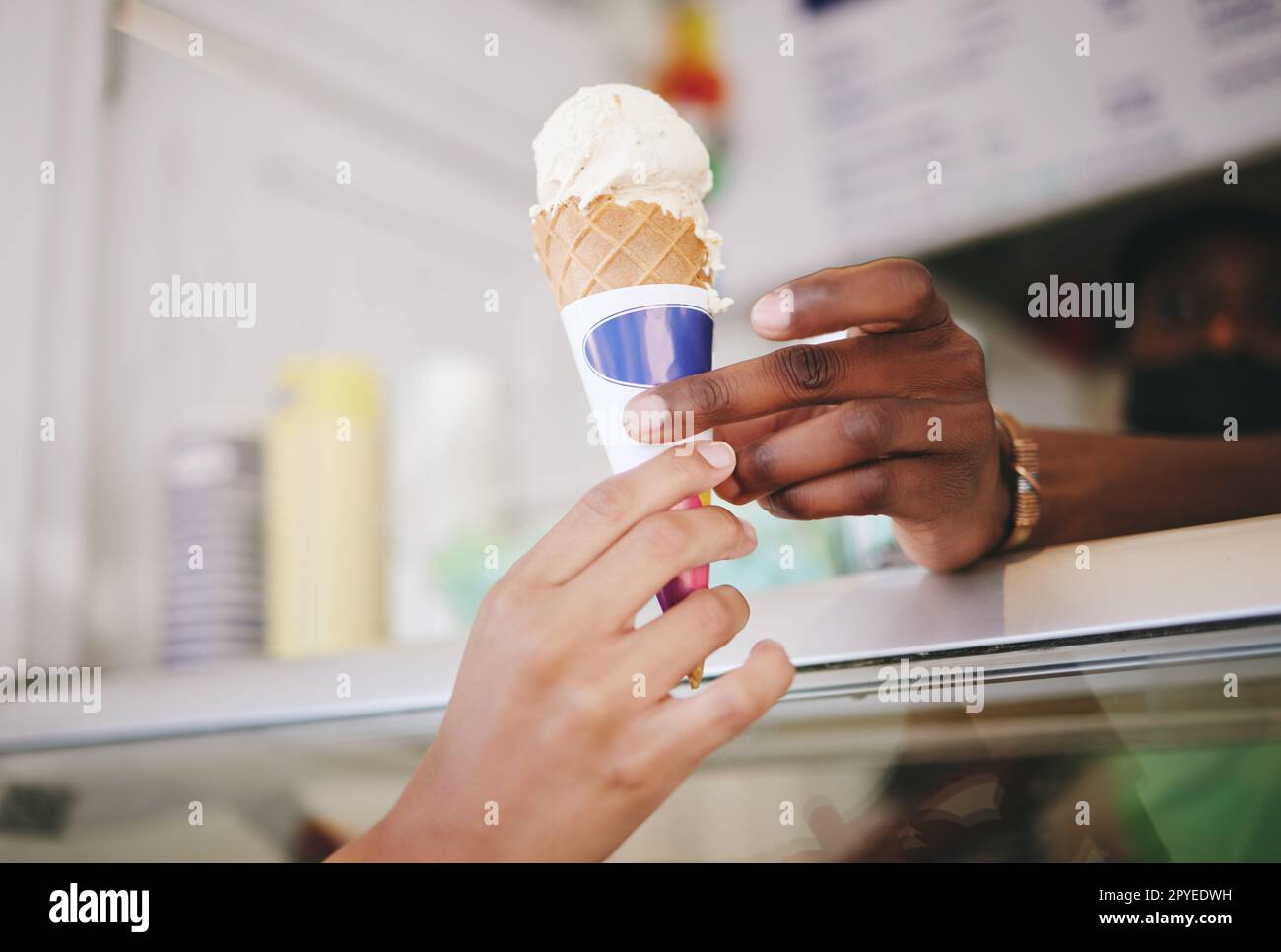 Hands, ice cream and woman buying icecream cone at a shop, local and small business support. Sugar, dessert and person purchase snack from seller to enjoy on summer day as a frozen sweet in the city Stock Photo
