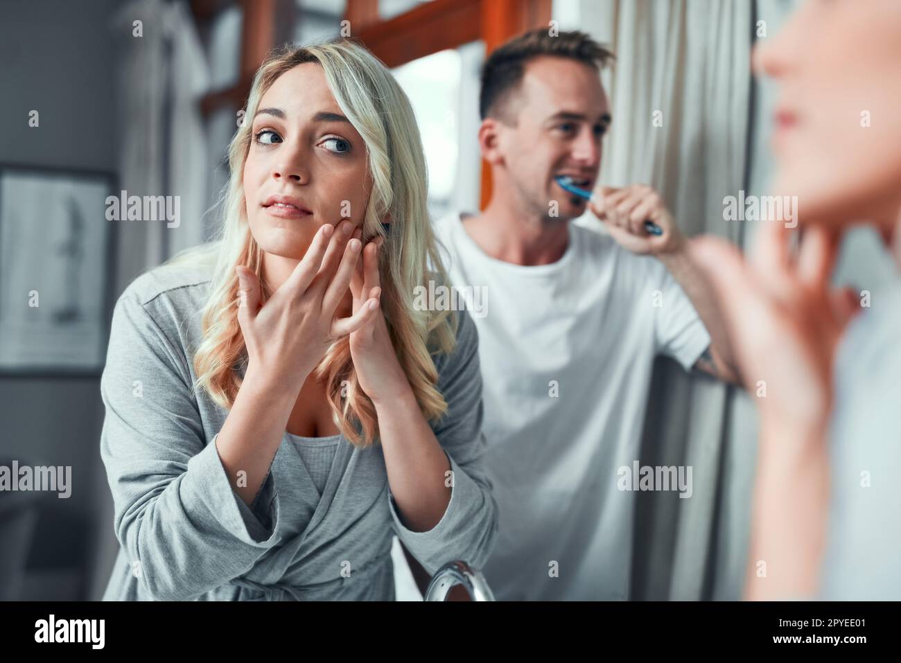 Freshening up for the day ahead. a young couple getting ready together in the bathroom at home. Stock Photo