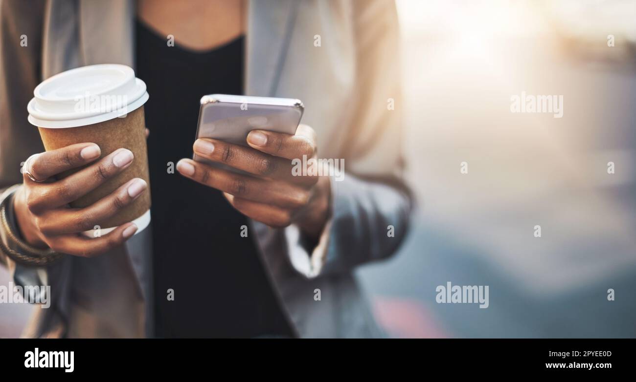 Were living in such a mobile world. Closeup shot of a businesswoman using a cellphone in the city. Stock Photo