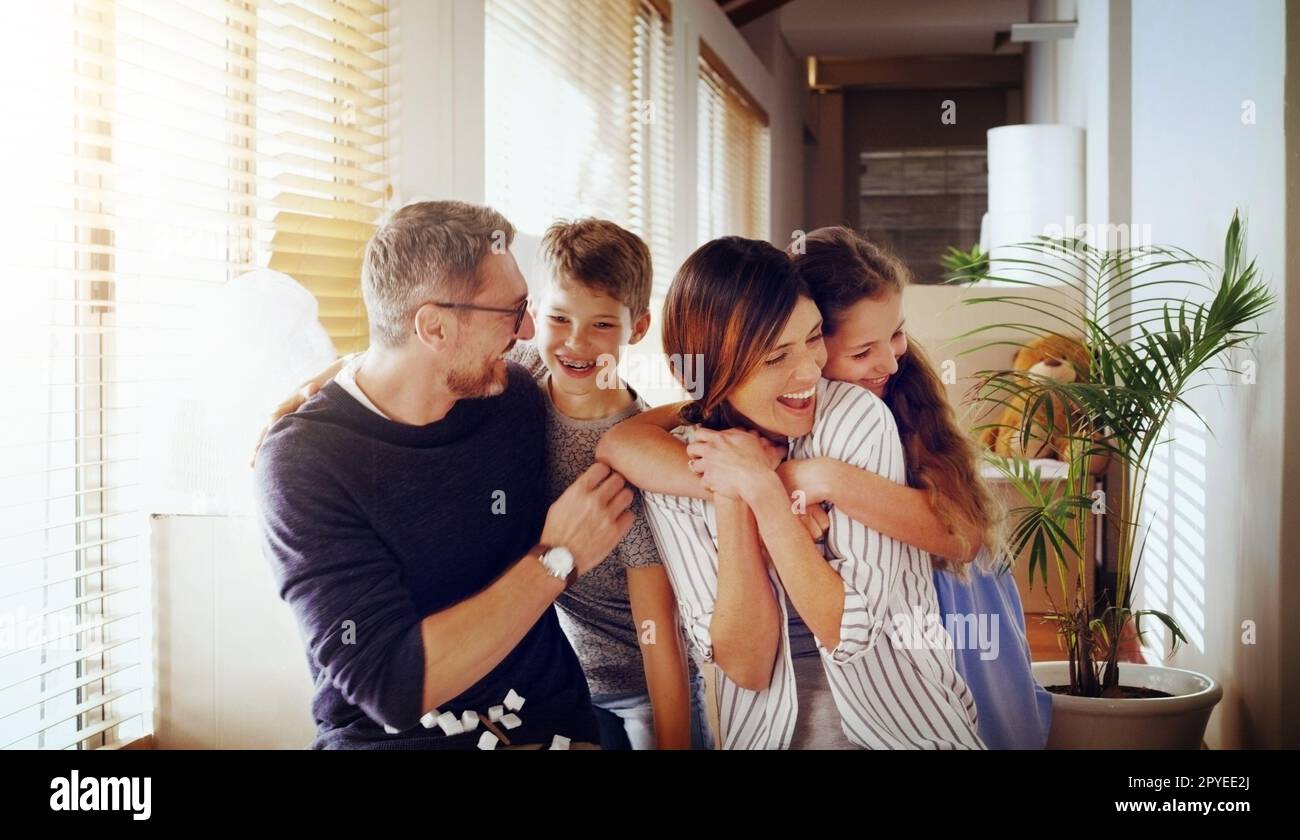Our home overflows with love and joy. a happy family together in their new home. Stock Photo