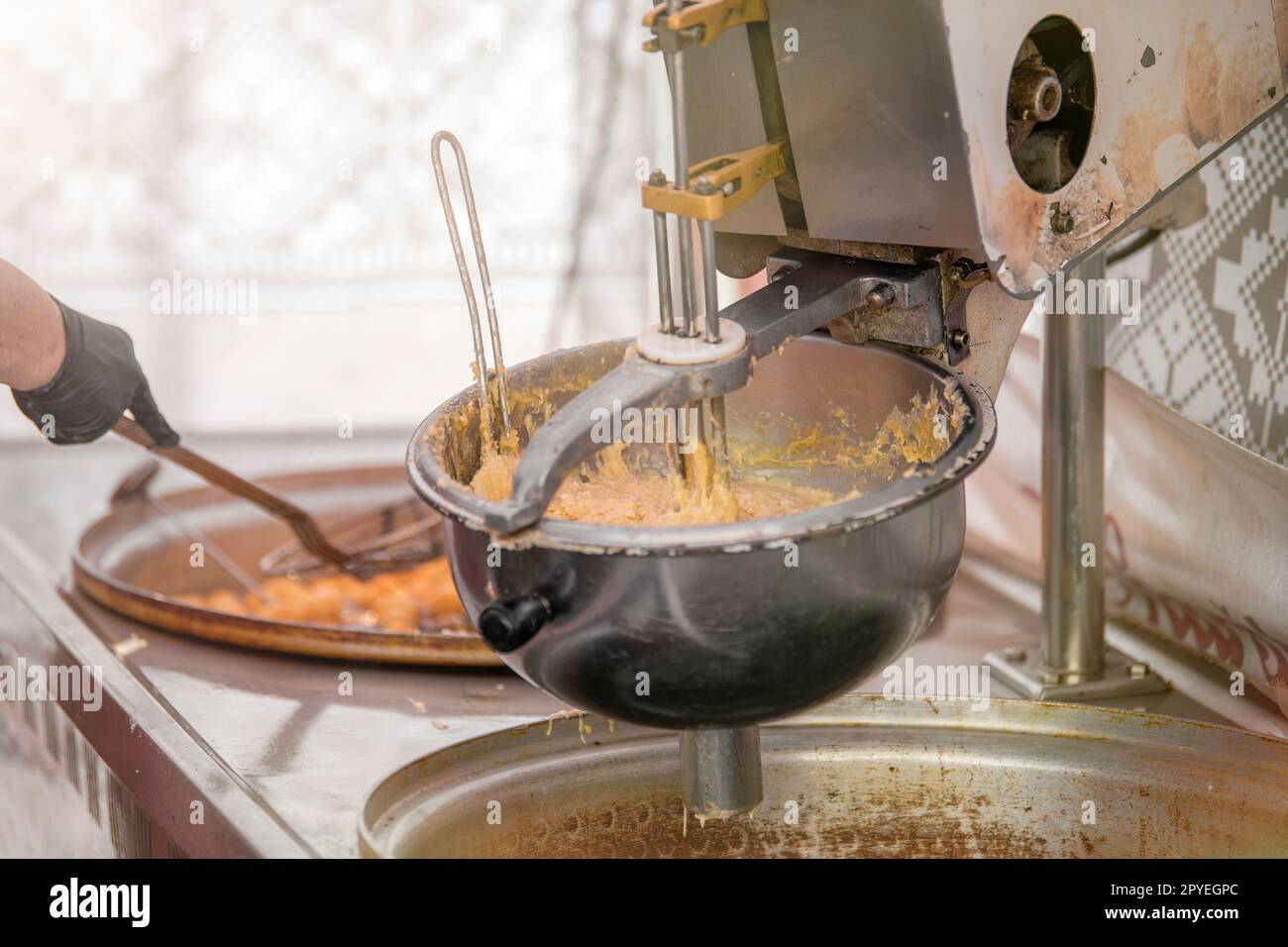 The process of making fresh cookies. Large industrial mixer closeup