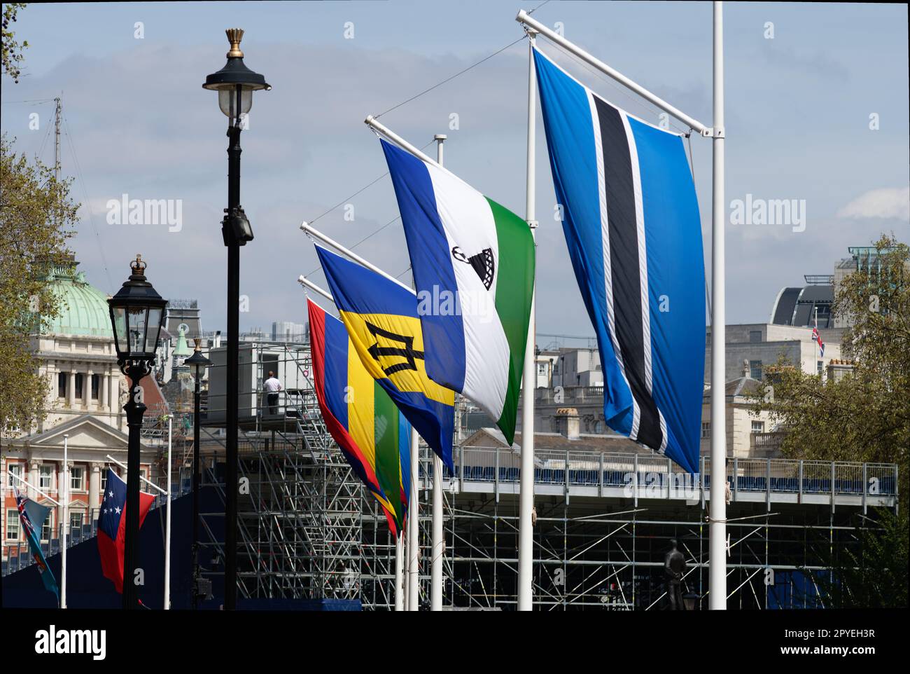 Flags on commonwealth nations Barbados, Lesotho, Mauritius and Botswana hanging along Horseguards in London prior to the coronation of king Charles. Stock Photo