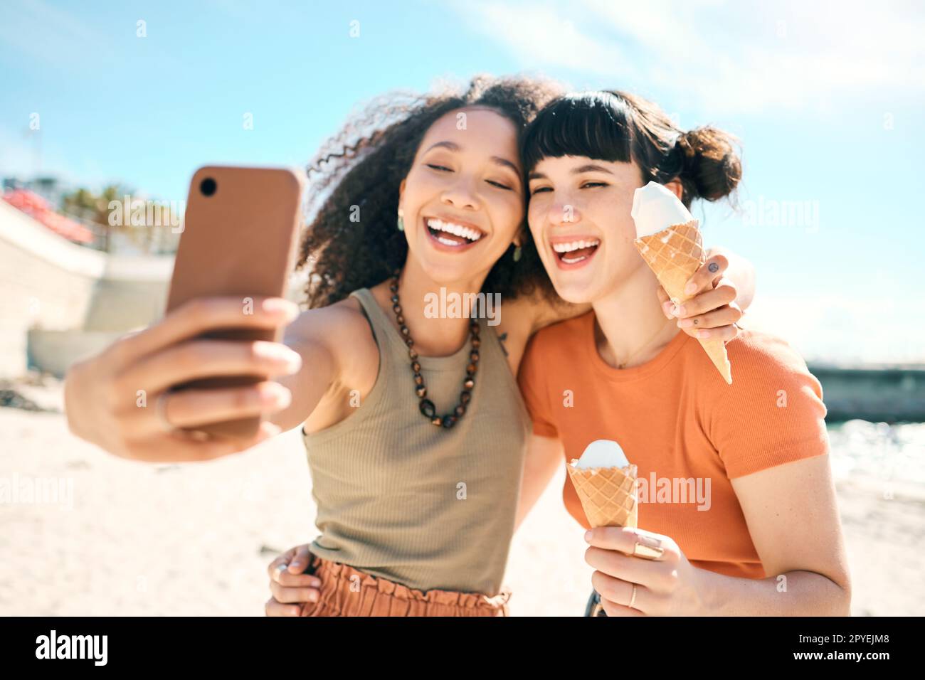 Summertime selfies. two attractive young girlfriends taking selfies ...