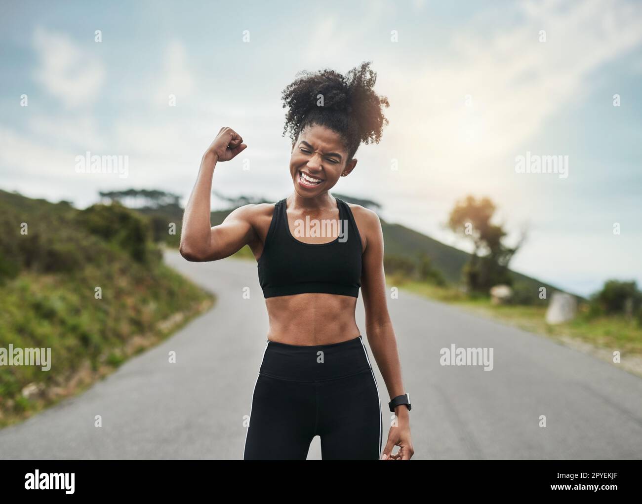 https://c8.alamy.com/comp/2PYEKJF/strong-is-a-mindset-an-attractive-young-sportswoman-flexing-her-bicep-outside-2PYEKJF.jpg