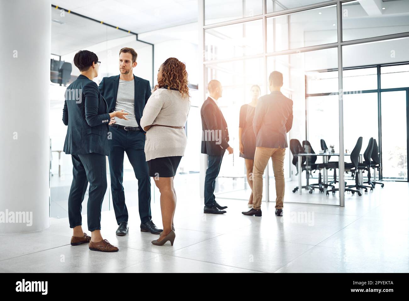 Conversations to improve the business. businesspeople having a conversation in the office. Stock Photo