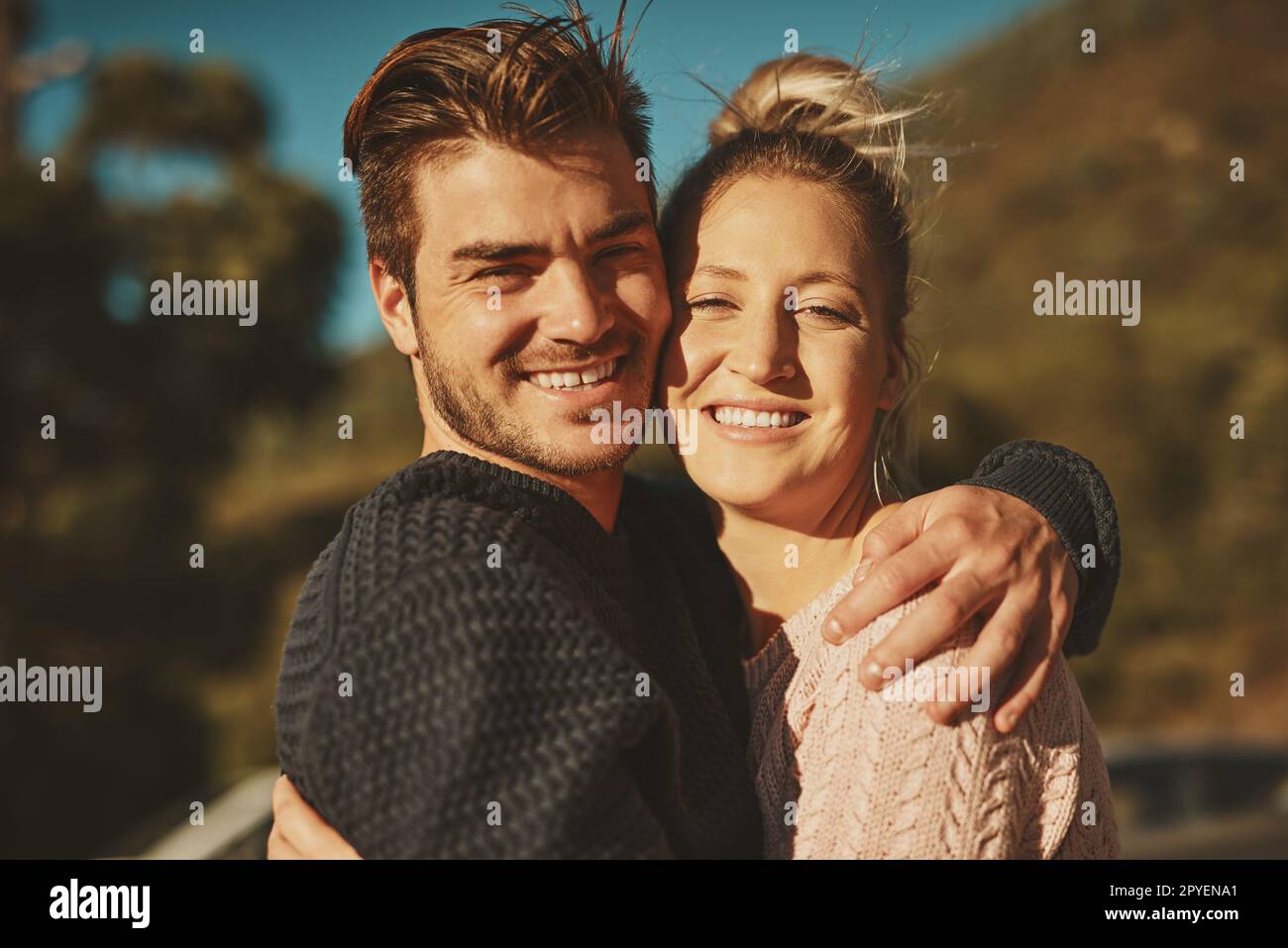 We love being outdoors. an affectionate couple spending the day outdoors. Stock Photo