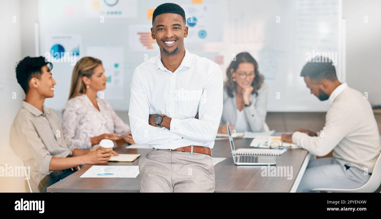 Corporate black man, team leader and smile at business meeting, planning and financial strategy in office. African businessman, happy leadership and budget meeting with business people for accounting Stock Photo