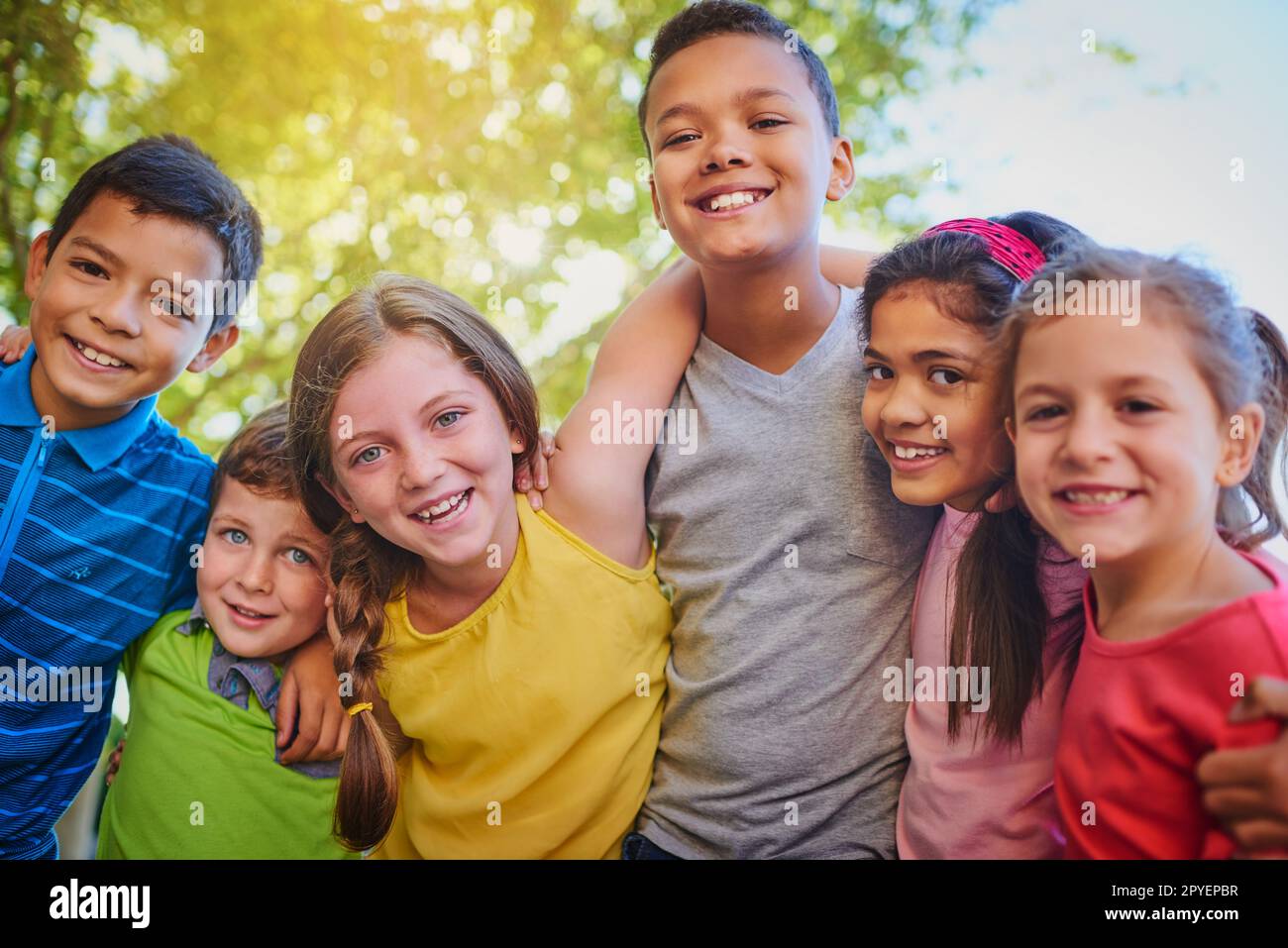 The fun never stops when you a kid. a diverse group of children outside. Stock Photo