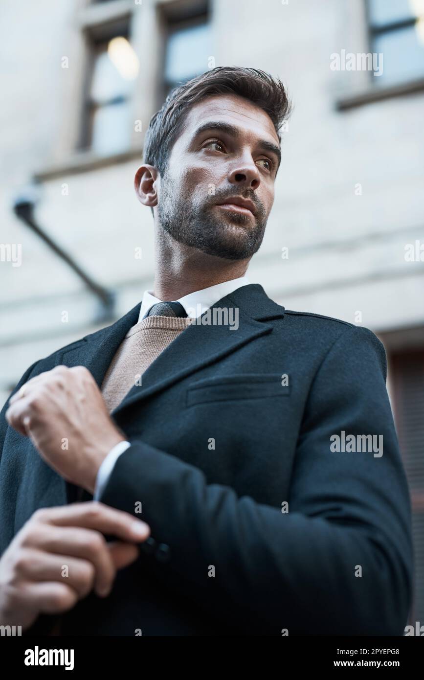 Making sure he looks his best. Low angle shot of a handsome businessman about town. Stock Photo