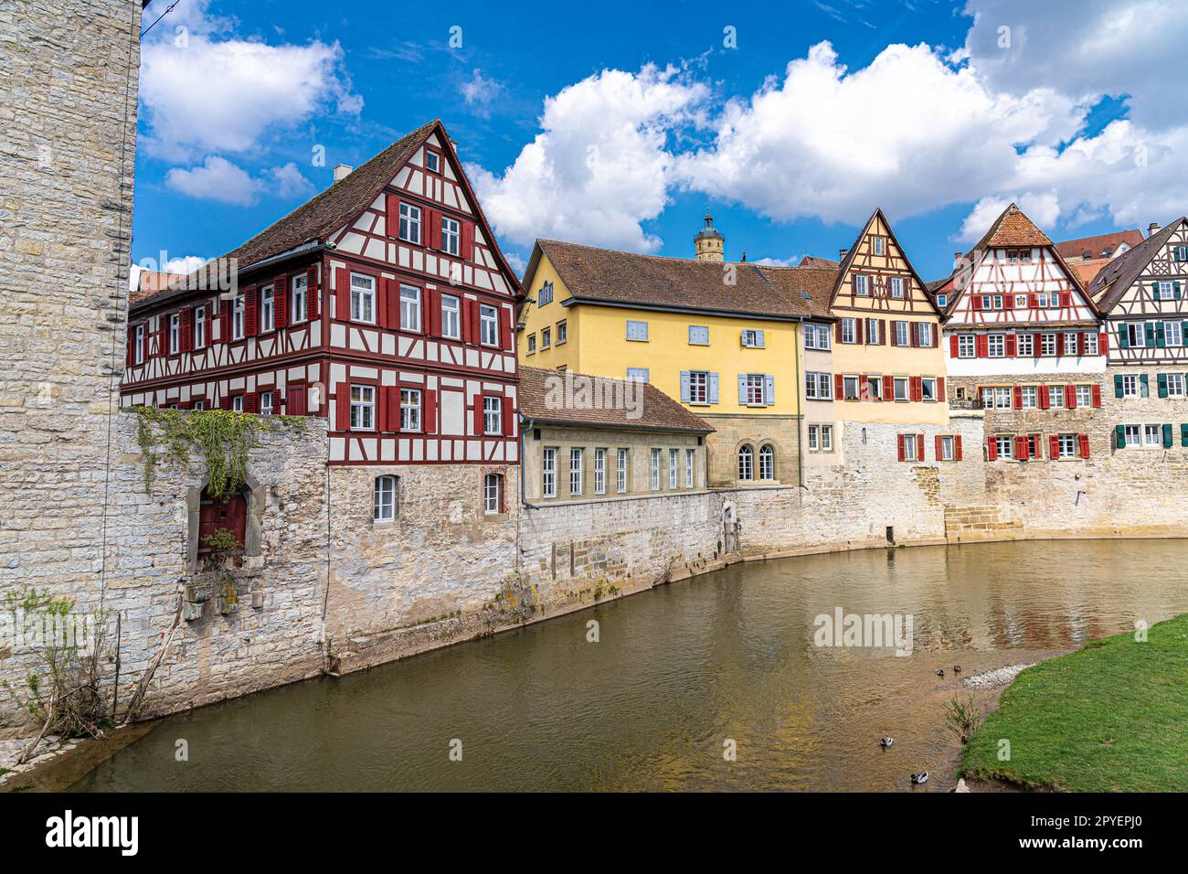 Old half-timber houses with colored shutters along the river Stock Photo