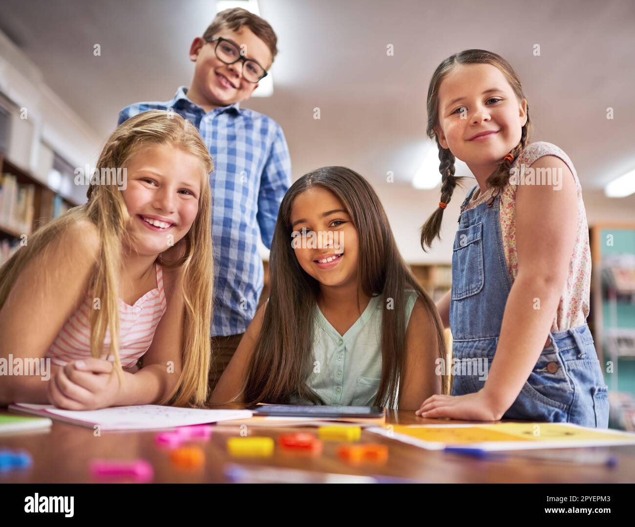 We love learning together. Portrait of a group of young children at school. Stock Photo