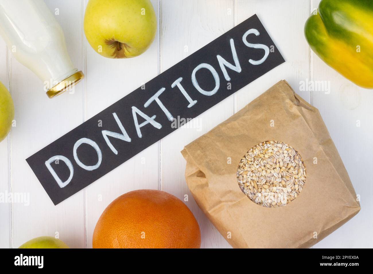 Cereals, canned food, milk, vegetables and fruits with a chalk ...