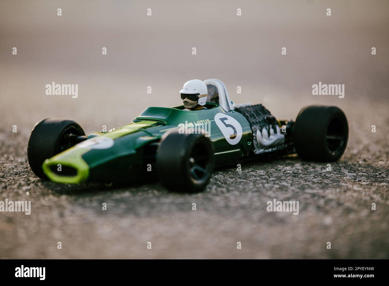 A detailed miniature race car with a green and white paint job Stock Photo
