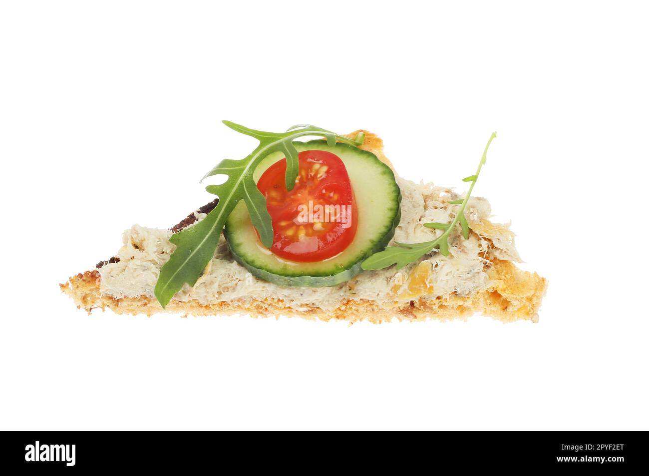 Smoked mackerel pate with salad garnish on a triangle of toast isolated