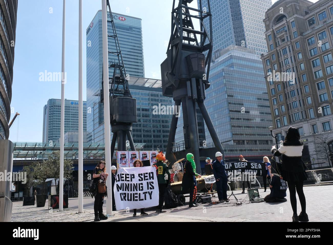 London, UK. 3rd May, 2023. Environmental activist group Ocean Rebelllion staged a heavy metal performance protest with Dutch band 'The Polymetallic Nodules' outside the venue hosting the two-day Deep Sea Mining Summit in Canary Wharf. The group opposes deep sea mining projects with grave concerns it would cause environmental harms including the destruction of sea beds and marine habitats - as well as water pollution during the process of extracting minerals. Credit: Eleventh Hour Photography/Alamy Live News Credit: Eleventh Hour Photography/Alamy Live News Stock Photo