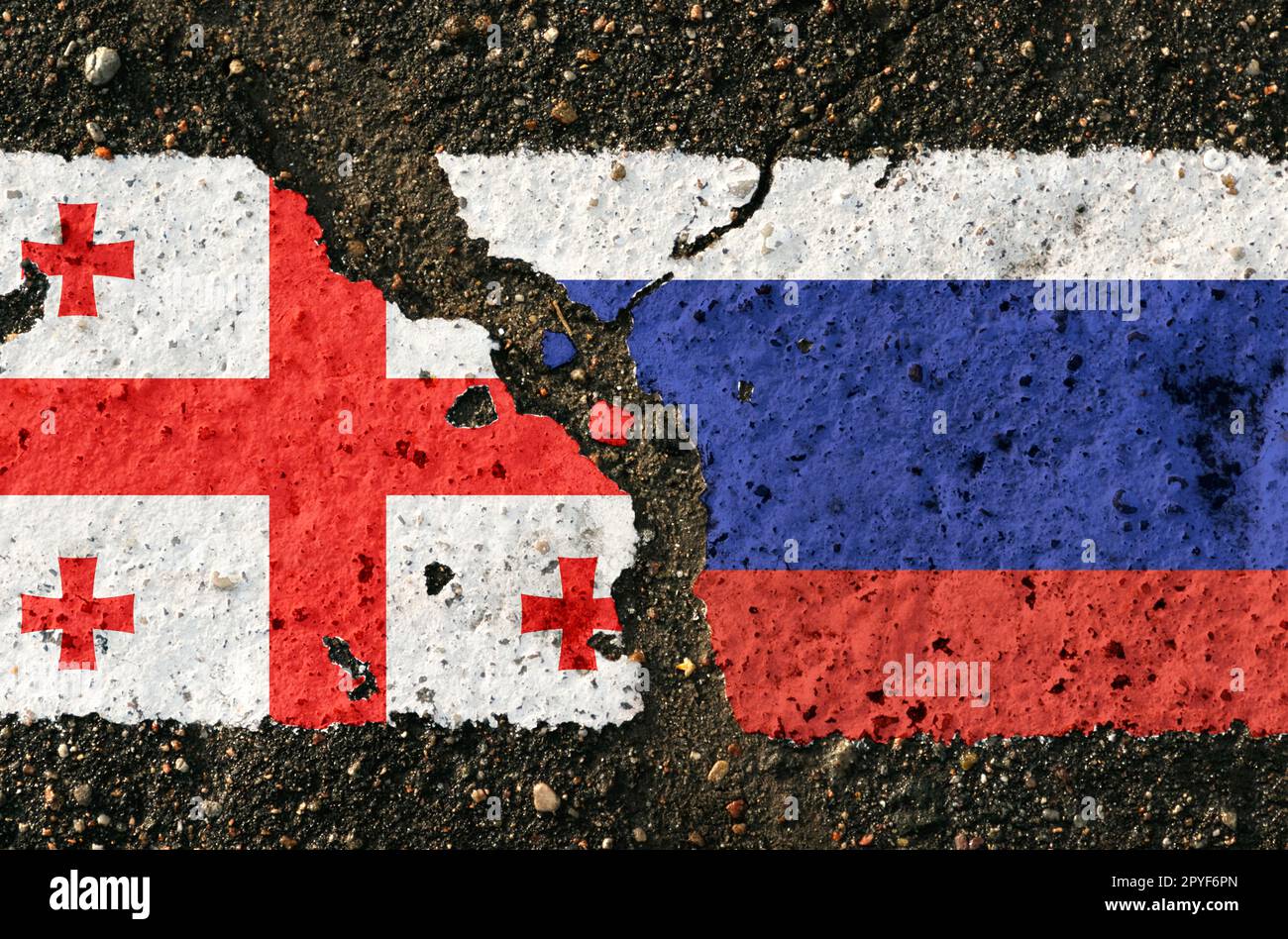 On the pavement are images of the flags of and Russia, as a