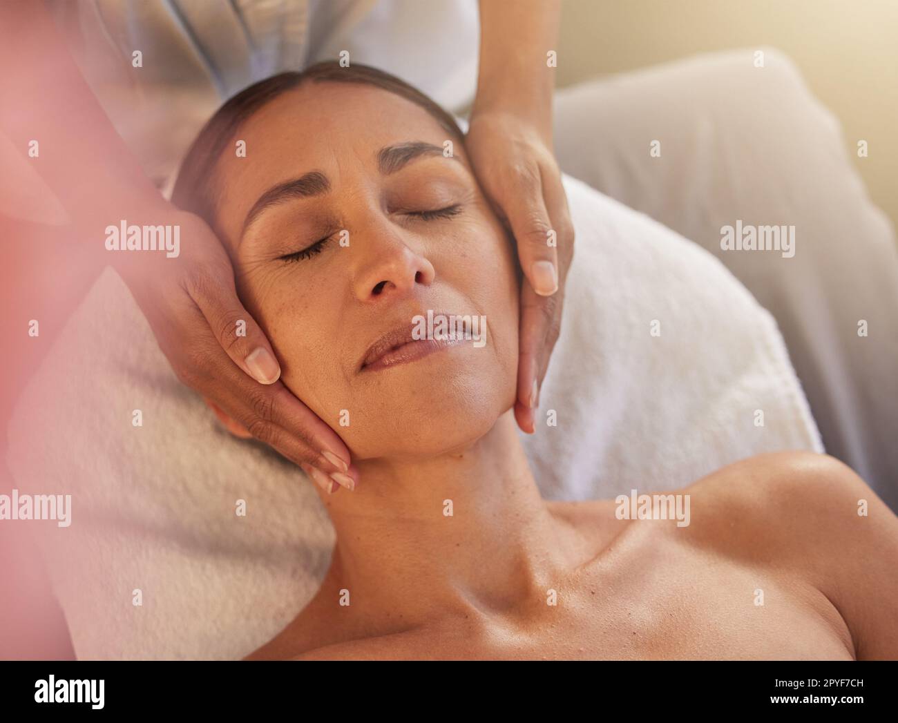 Woman, face and hands for massage in beauty salon for relax physical therapy, skincare wellness and luxury spa wellness. Masseuse, facial care and dermatology therapy for smooth, glow and body care Stock Photo
