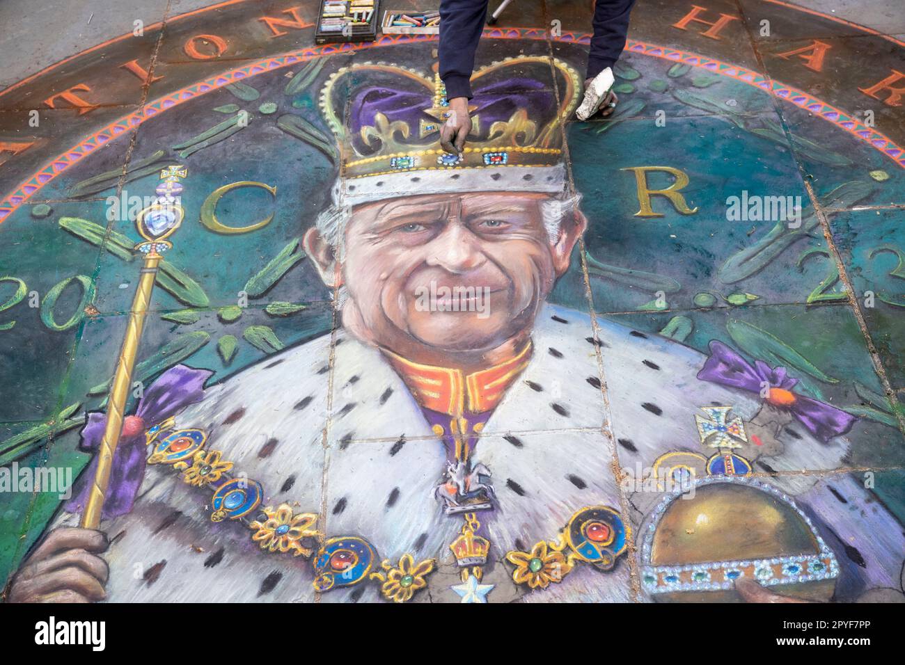 London, UK. 3 May 2023. Pavement chalk artist Julian Beever works on his artwork near Trafalgar