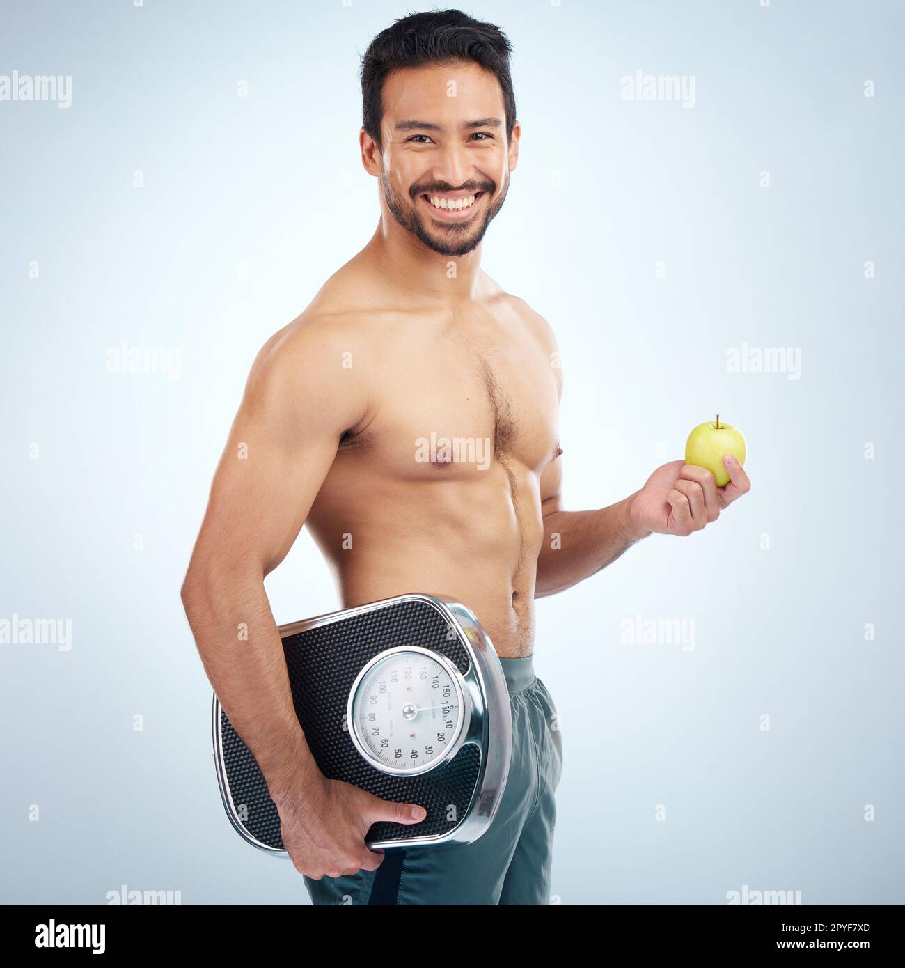Healthy young man weight scale hi-res stock photography and images - Alamy
