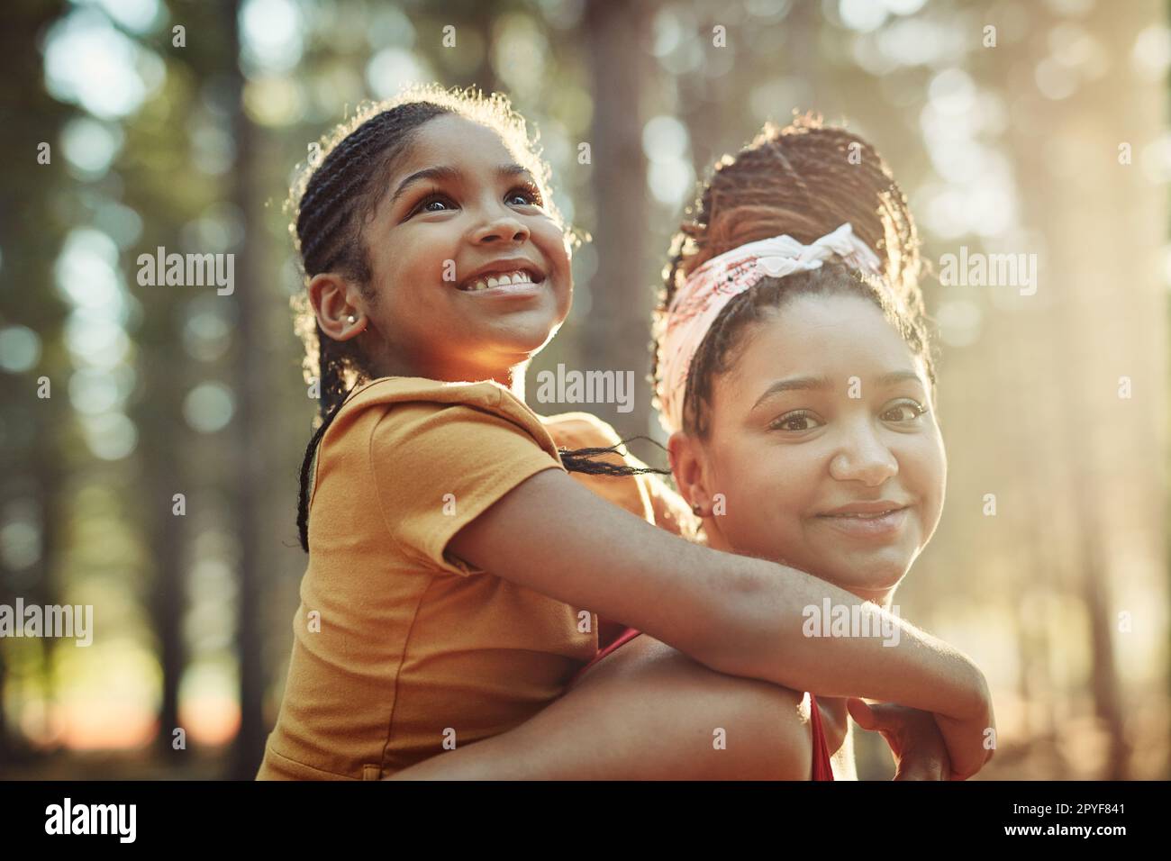 Having some fun with Mum in the forest. a mother and her little daughter bonding in the woods. Stock Photo