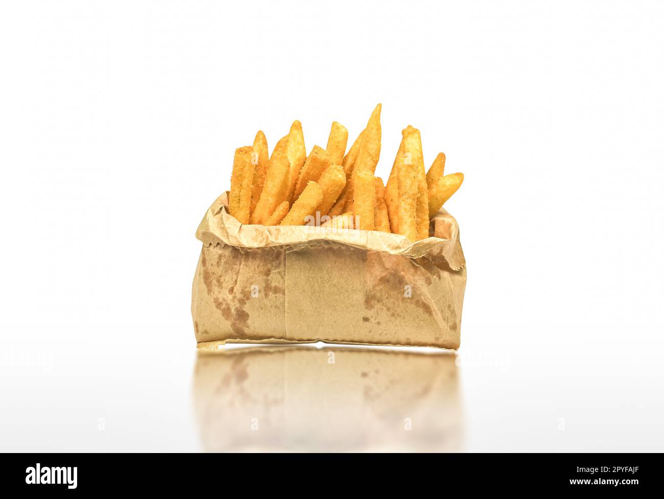 French Fries In A Brown Kraft Paper Bag. Fast Food. Food Paper Packaging  From Environmentally Friendly Materials. Eco Friendly Fast Food Containers.  Brown Background. View From Above. Stock Photo, Picture And Royalty