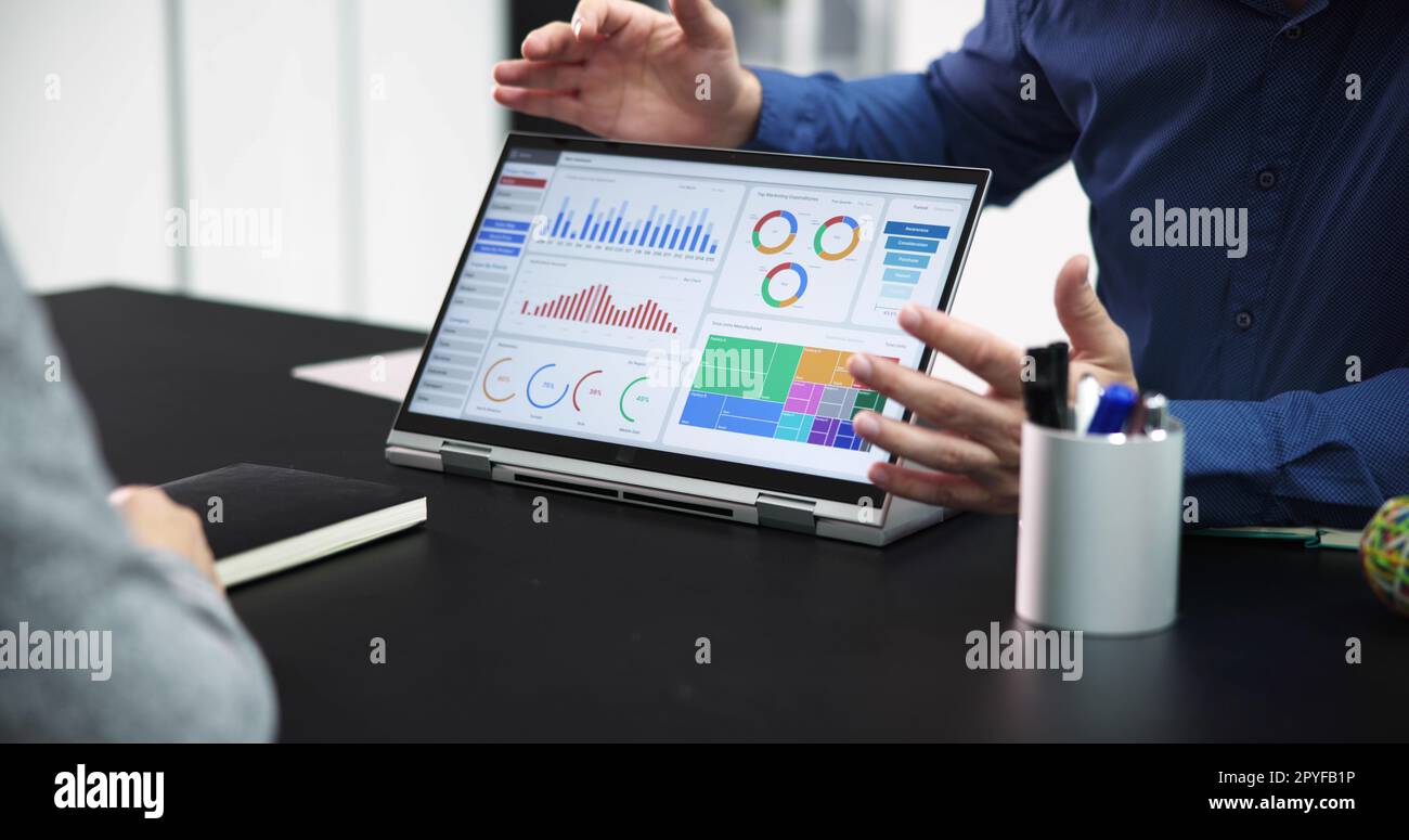 Analyzing digital data graphs people hi-res stock photography and ...