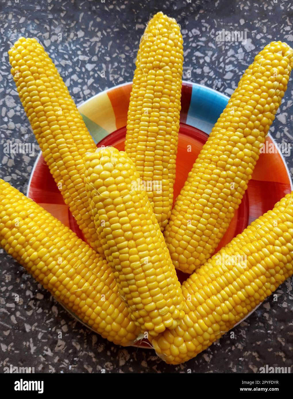 Boiled juicy corn on a plate Stock Photo