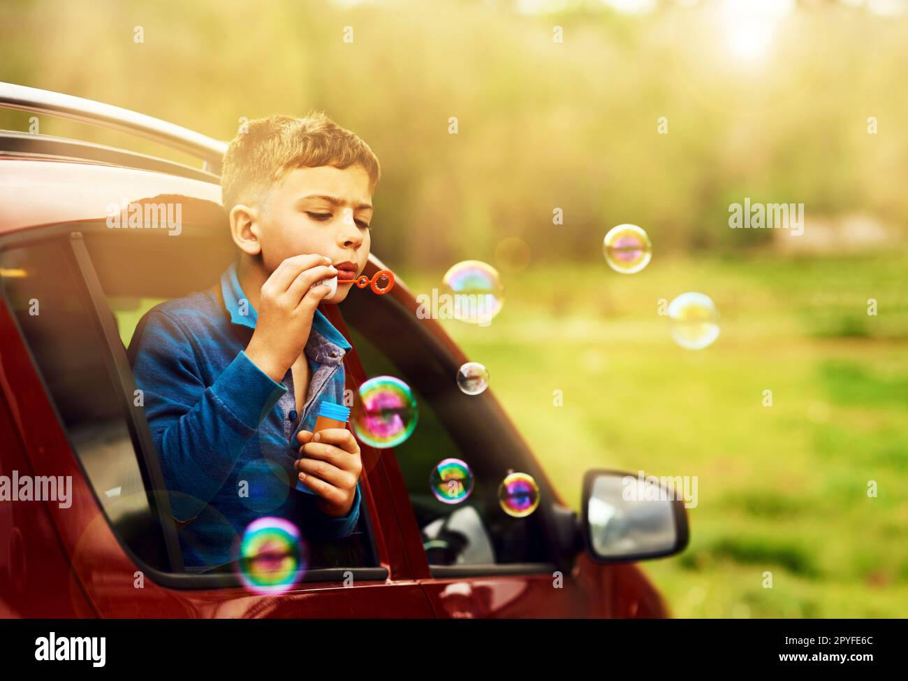 Perfect bubbles require focus and technique. a playful little boy