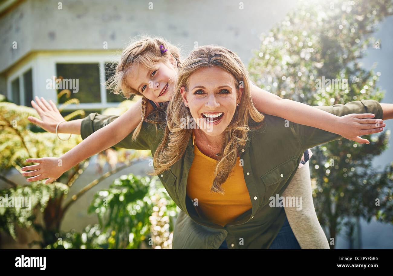 Shes turned motherhood into one fun ride for Mom. Portrait of a mother and her little daughter bonding together outdoors. Stock Photo