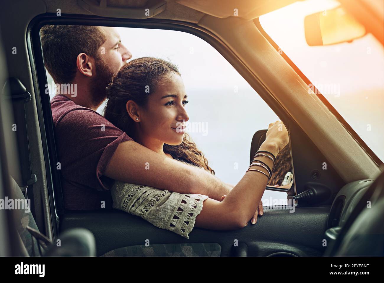 This is bliss. a young couple enjoying a roadtrip together. Stock Photo