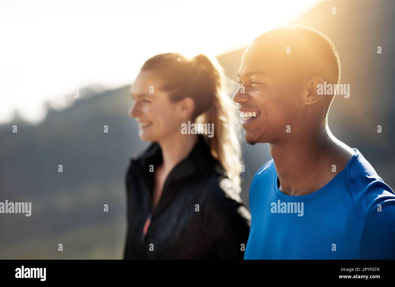 Running is the touchstone that breathes adventure into my soul. two athletes standing outdoors. Stock Photo