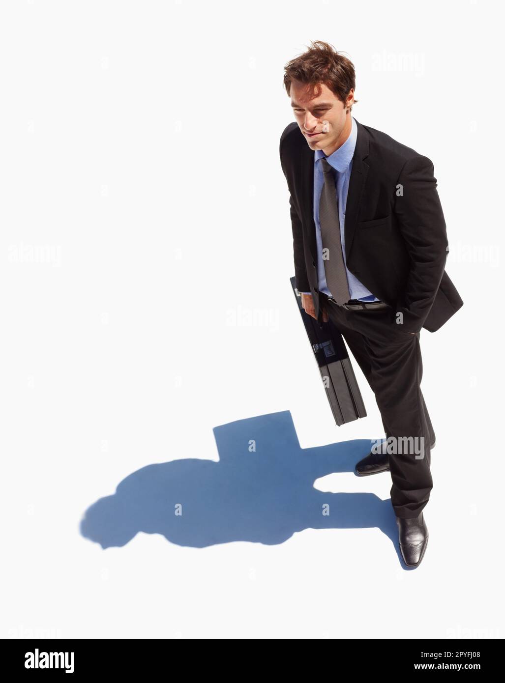 Top view of a business man standing isolated on a sunny day. Top view of a young business man standing isolated on a sunny day. Stock Photo