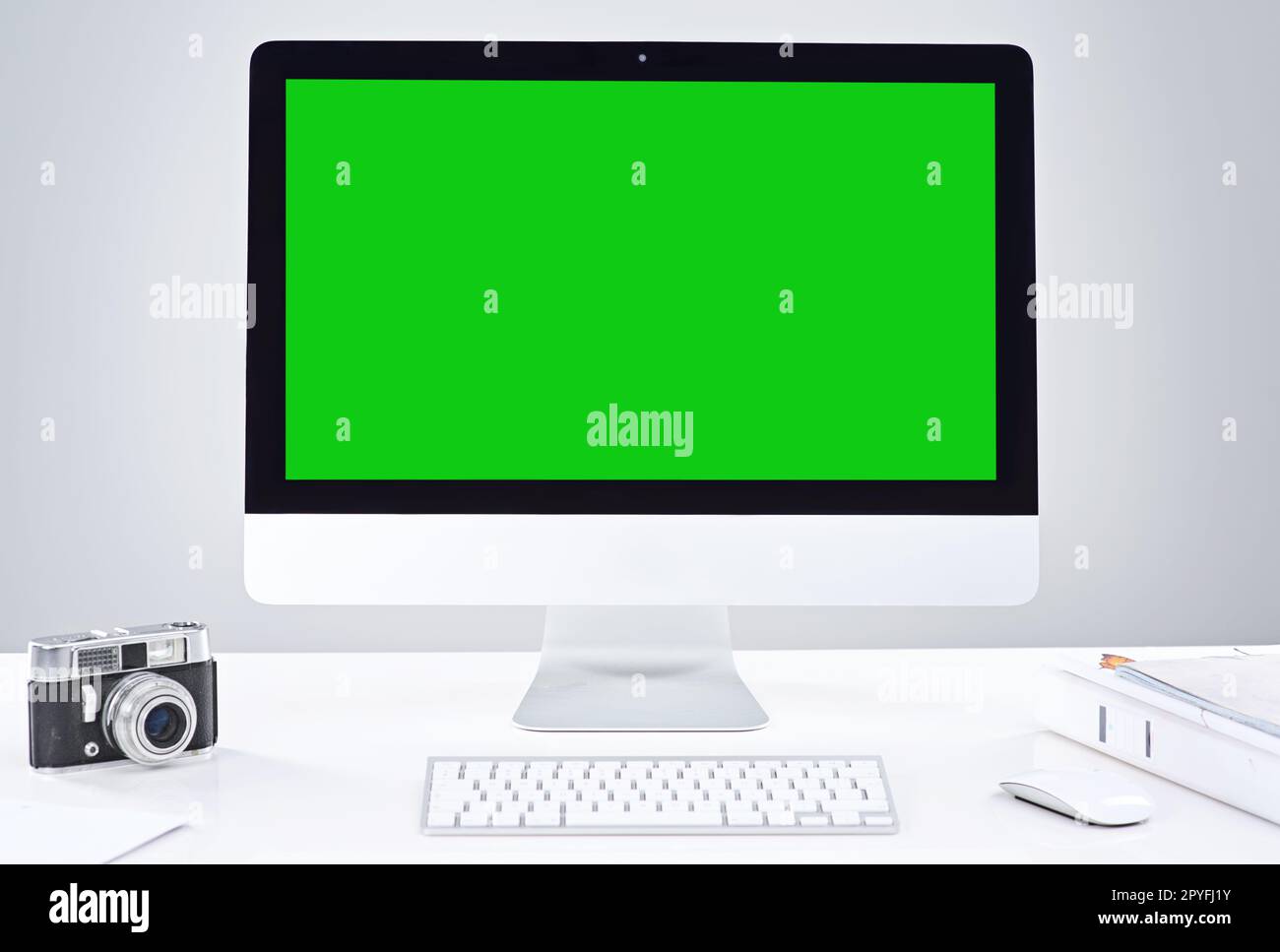 Give your photography business a blog. a desktop PC with a green screen. Stock Photo