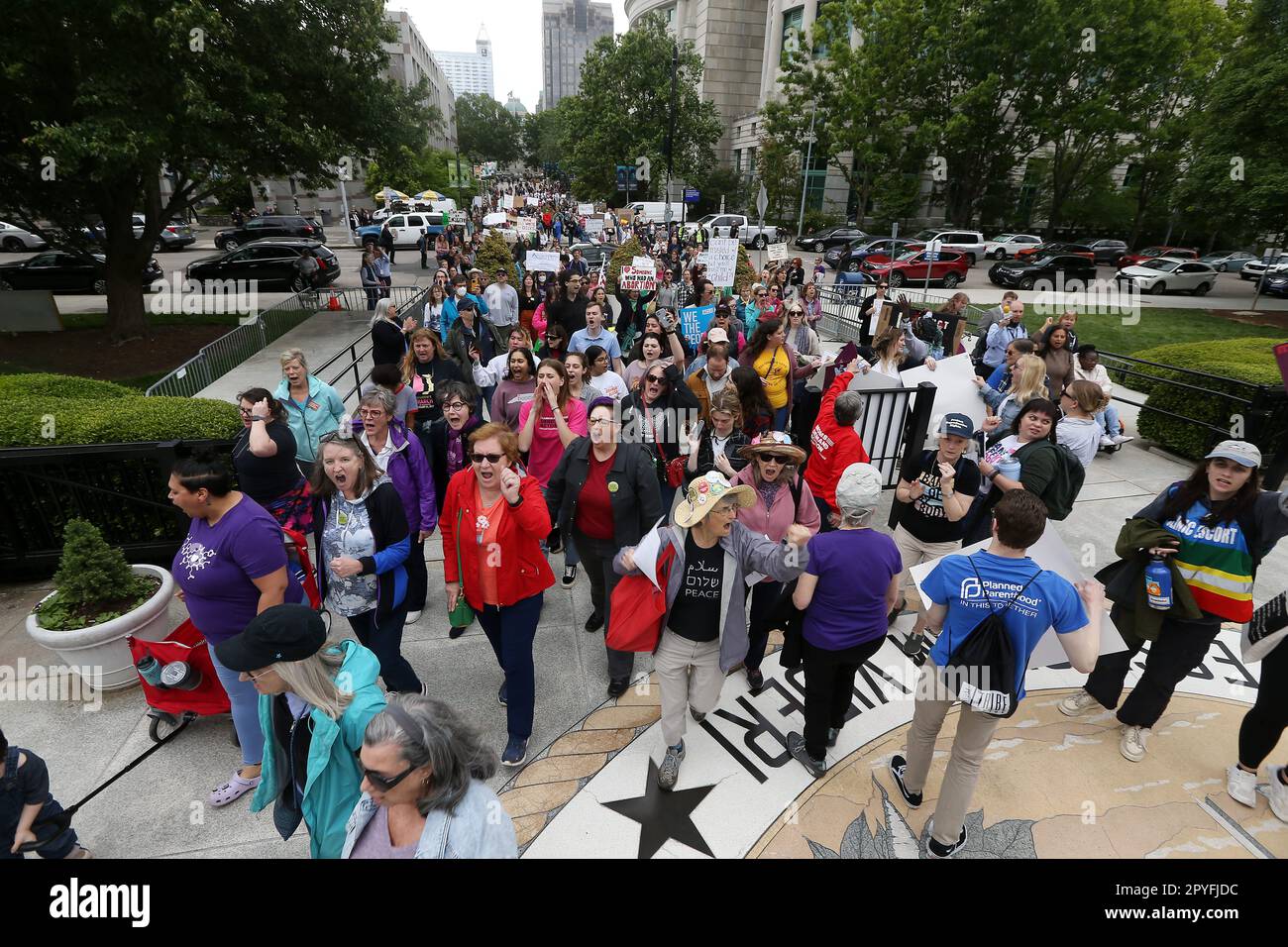 Raleigh, North Carolina, USA. 3rd May, 2023. Hundreds march to the NC Legislative building after attending a ''˜Bans Off Our Bodies' Rally at Bicentennial Plaza in Raleigh North Carolina protesting Republican lawmakers deal to restrict abortion after the first trimester of pregnancy. Republican state lawmakers say they have reached a consensus after months of negotiations and will unveil a 12-week abortion ban, with exceptions, this week. (Credit Image: © Bob Karp/ZUMA Press Wire) EDITORIAL USAGE ONLY! Not for Commercial USAGE! Stock Photo