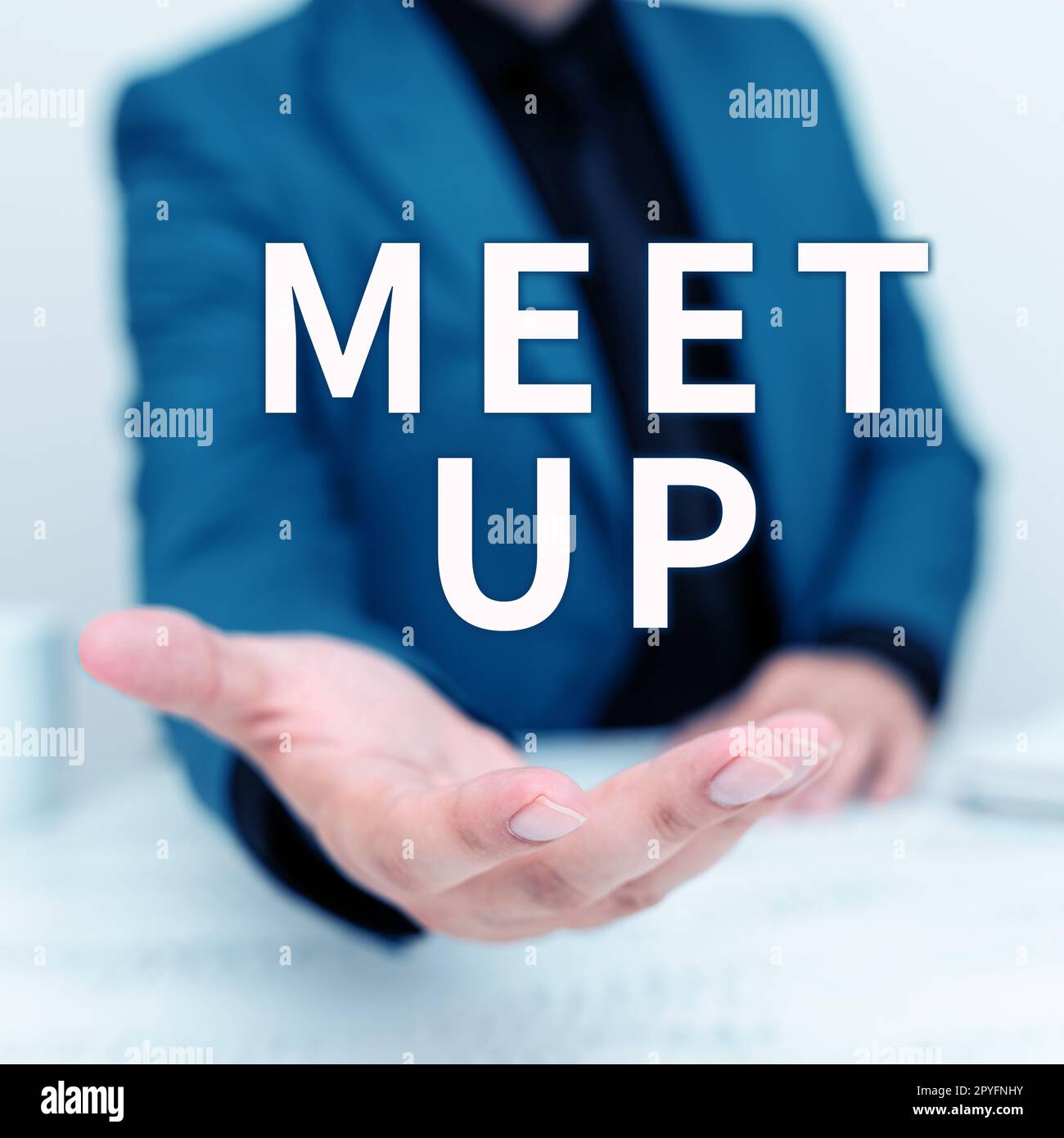 Sign displaying Meet Up. Word for Informal meeting gathering Teamwork Discussion group collaboration Stock Photo