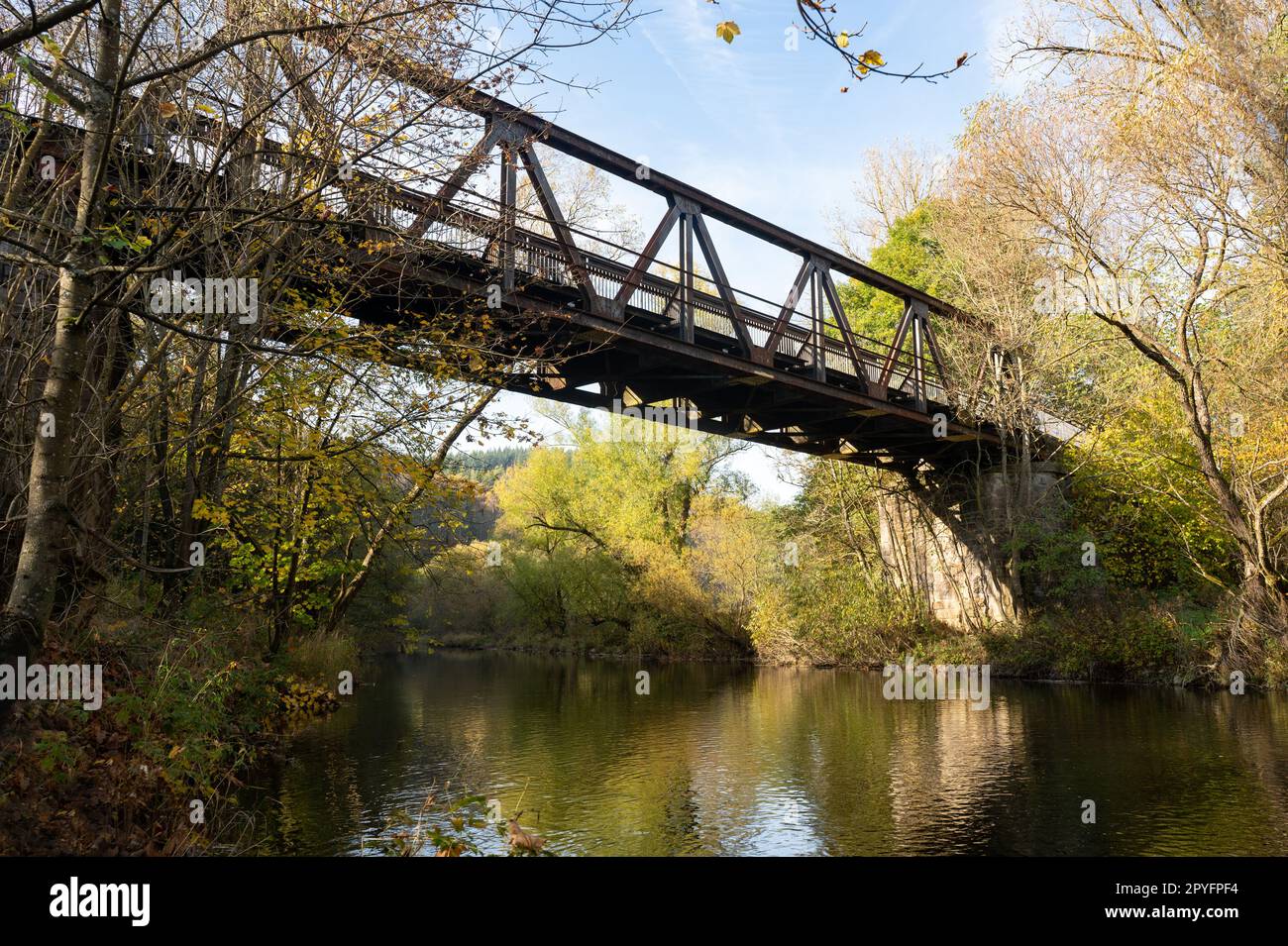 Iron bridge over a river in nature Stock Photo - Alamy