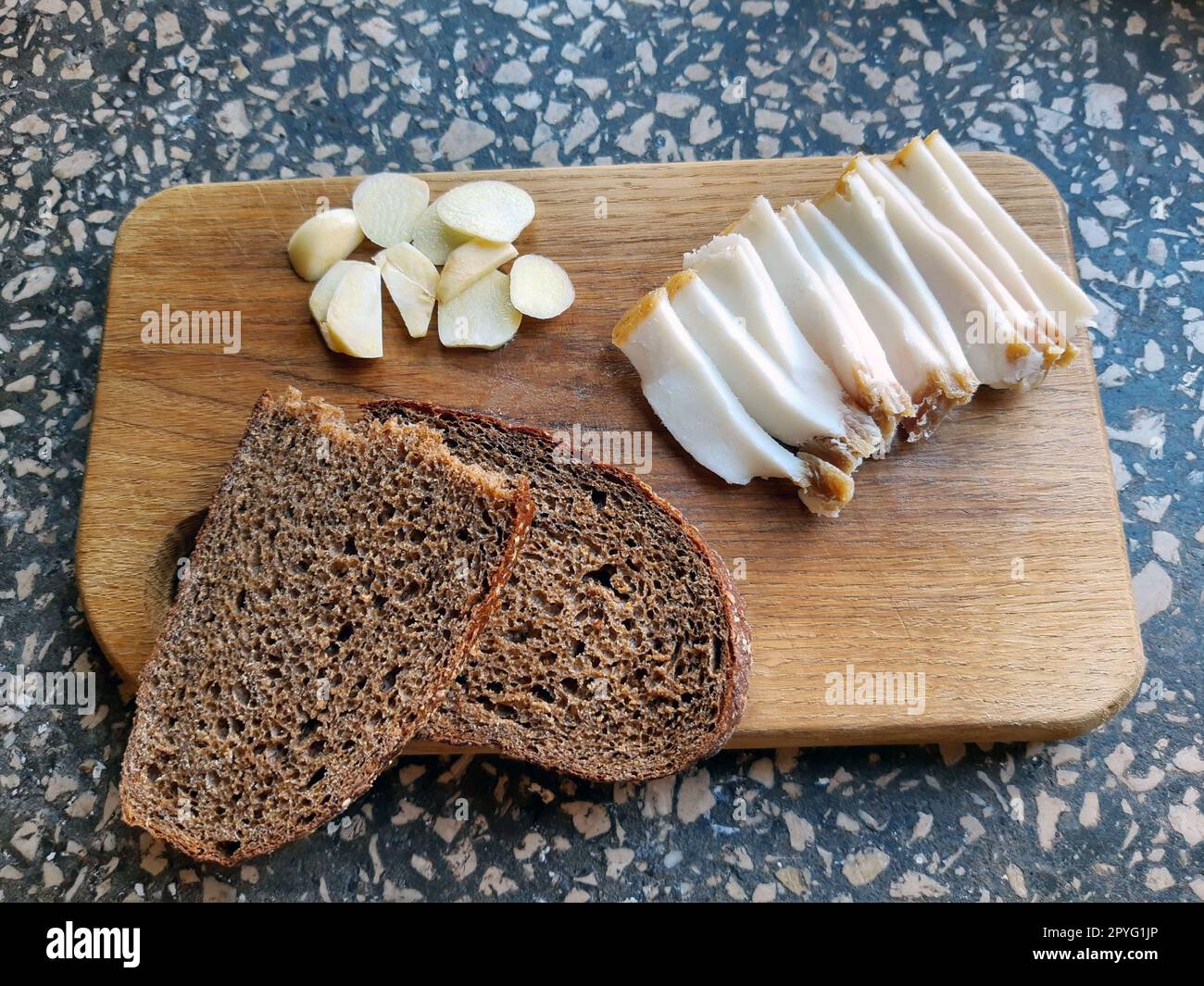 Salo bread and garlic on a wooden board Stock Photo
