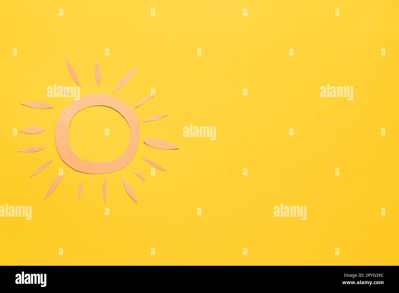 Paper sun on yellow background Stock Photo Alamy