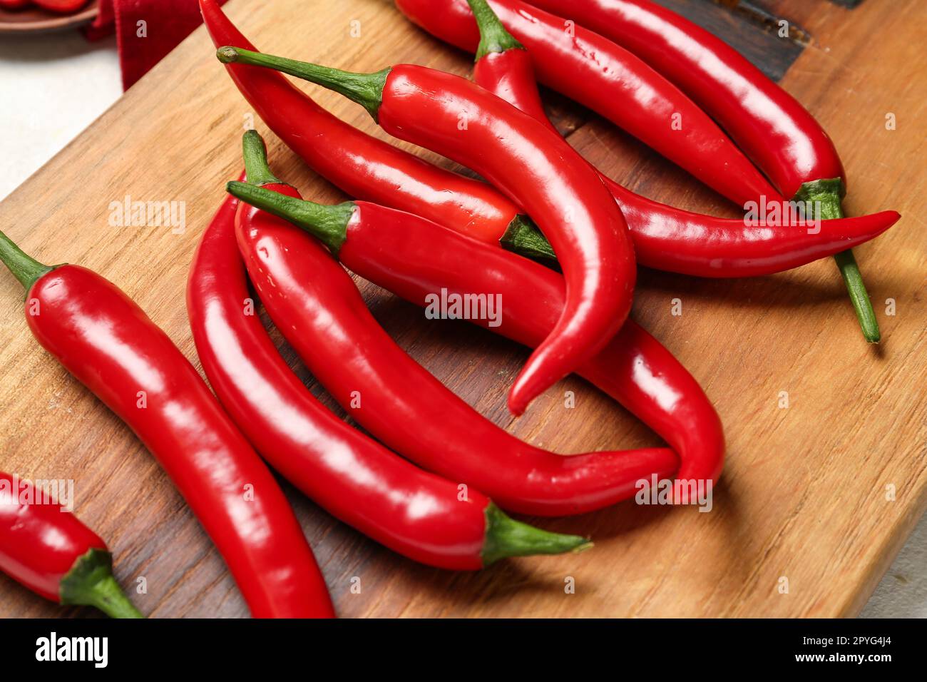 Board of fresh hot chili peppers on white background Stock Photo Alamy