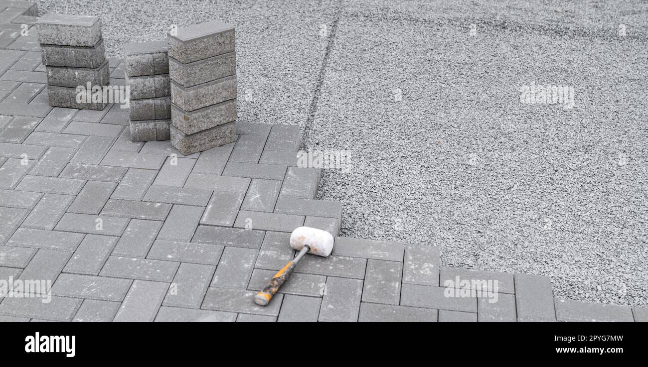 Building A Sidewalk, Laying Interlocking Pavers Stock Photo - Alamy