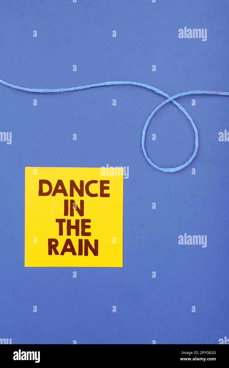 Conceptual caption Dance In The Rain. Conceptual photo Enjoy the rainy day childish activities happy dancing Stock Photo