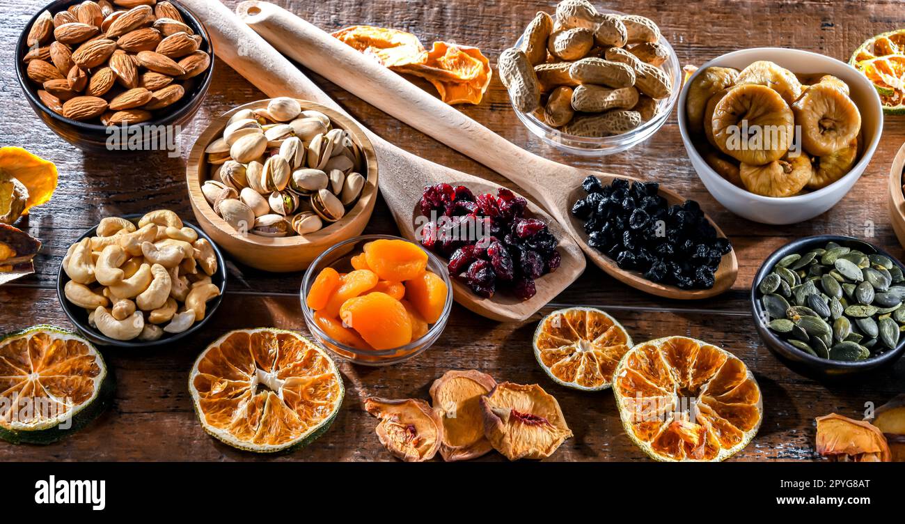 Composition with a variety of dried fruits and assorted nuts. Stock Photo