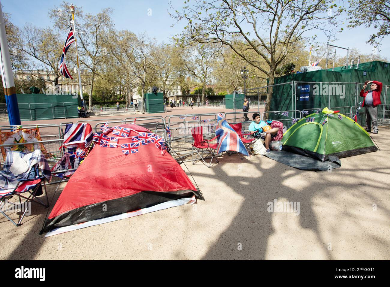 People camping near Buckingham Palace along The Mall waiting for the